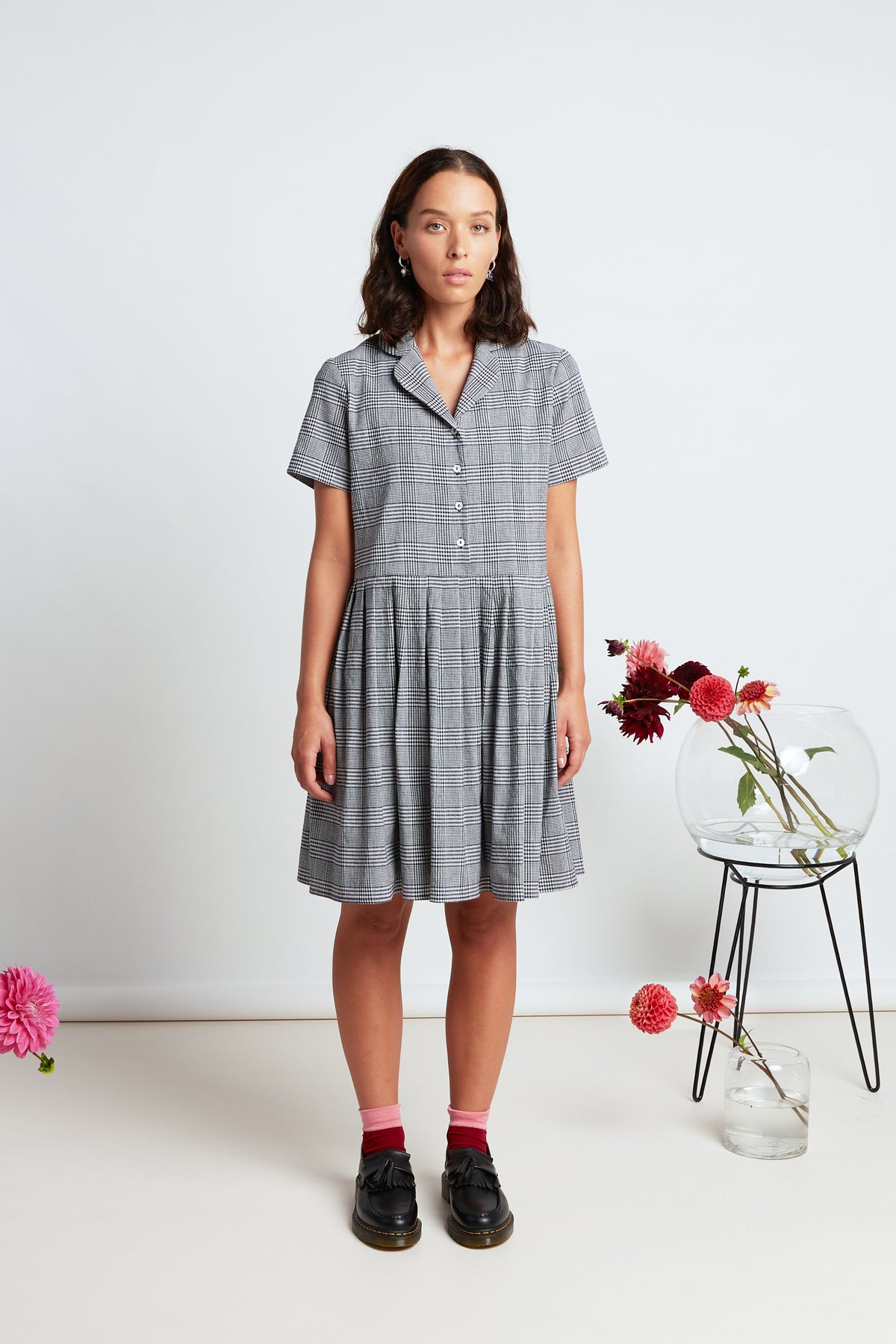 Melrose dress by twenty-seven names. A short sleeved, button front dress, with a curved blazer collar and short pleated skirt.