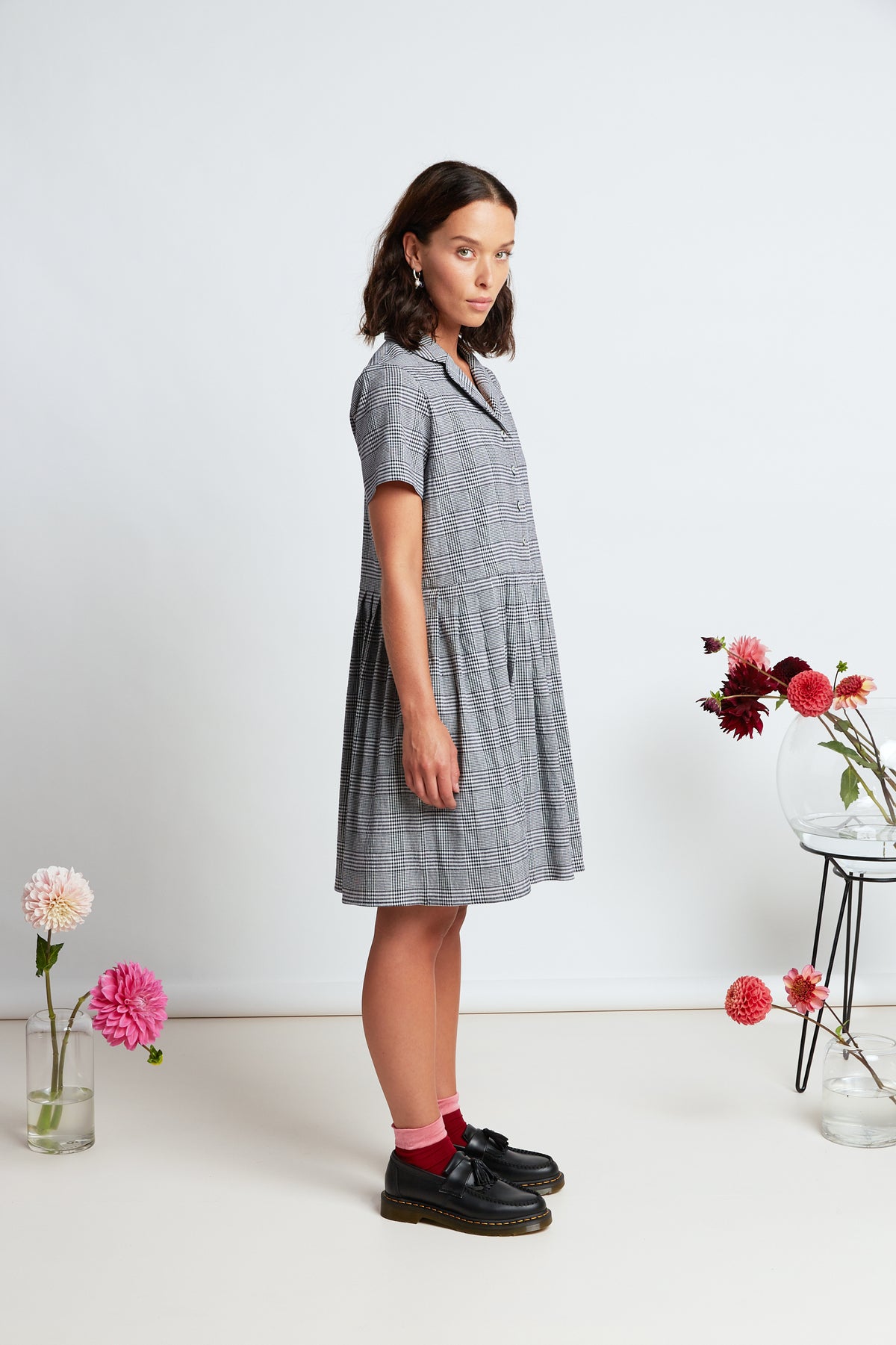 Melrose dress by twenty-seven names. A short sleeved, button front dress, with a curved blazer collar and short pleated skirt.